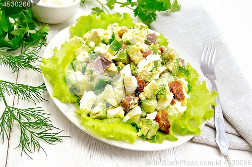 Image of Salad of salmon and avocado on board