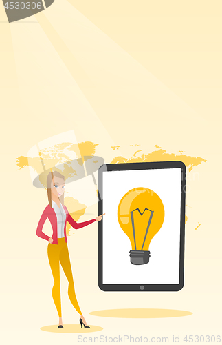 Image of Caucasian woman pointing at a big tablet computer.