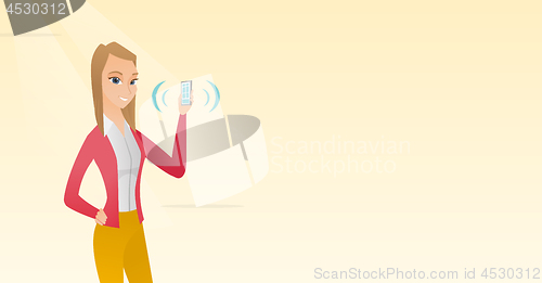 Image of Young caucasian woman holding ringing mobile phone