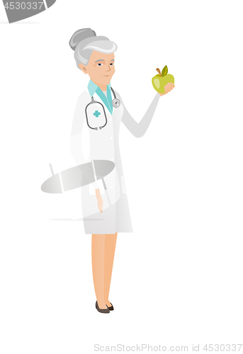 Image of Caucasian nutritionist offering fresh red apple.