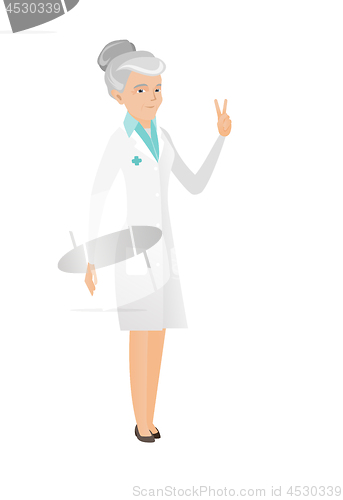 Image of Senior caucasian doctor showing victory gesture.