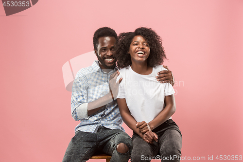 Image of Couple watching sports match on tv at home, celebrating victory, successful game