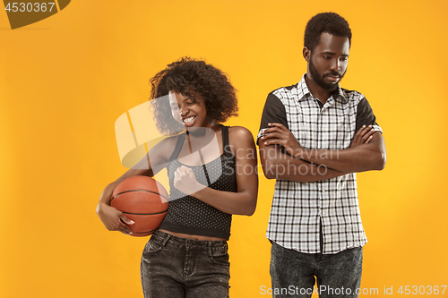 Image of The happy and angry fans on colored gold background.