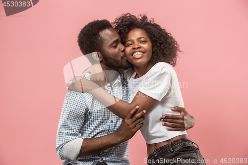 Image of Couple watching sports match on tv at home, celebrating victory, successful game