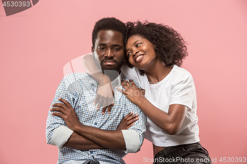 Image of Couple watching sports match on tv at home, celebrating victory, successful game