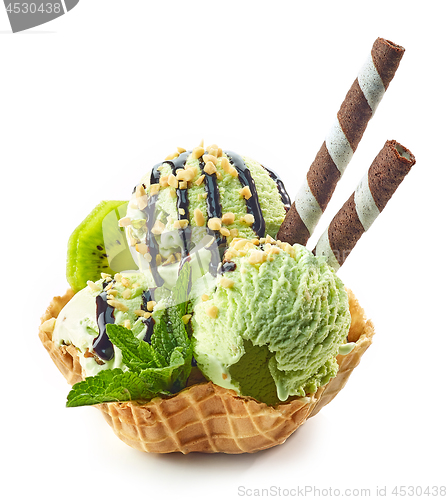 Image of green ice cream in waffle basket