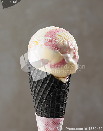 Image of ice cream ball in black waffle cone