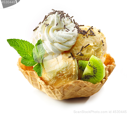 Image of orange ice cream in waffle basket