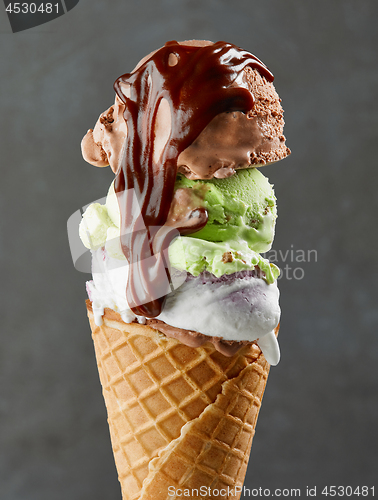 Image of various ice cream balls in waffle cone