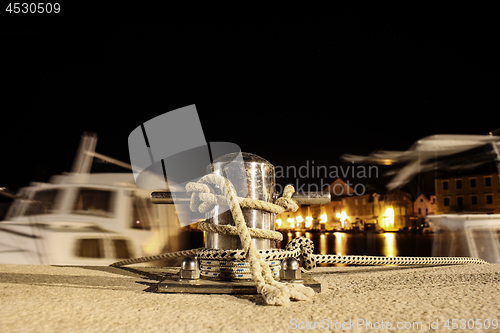 Image of Mooring post at night