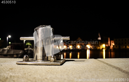 Image of Mooring post at night