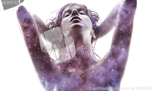 Image of double exposure of woman and purple galaxy