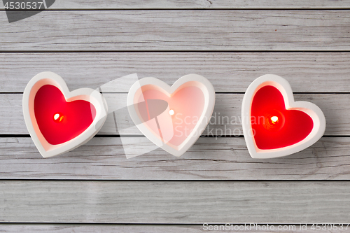 Image of heart shaped candles burning on valentines day