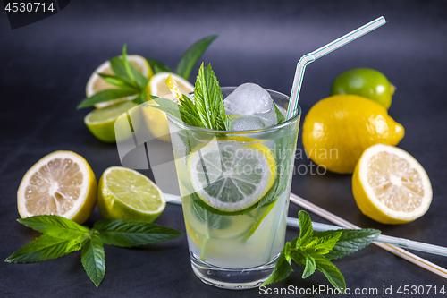 Image of Cold refreshing summer lemonade with mint in a glass