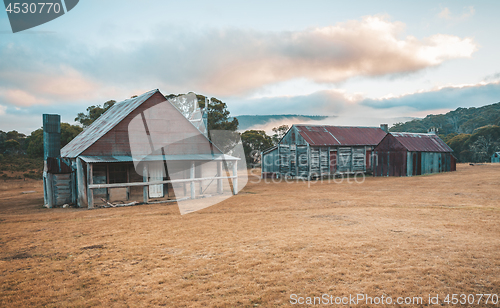 Image of Log huts in Snowy Mountains Australia sunrise