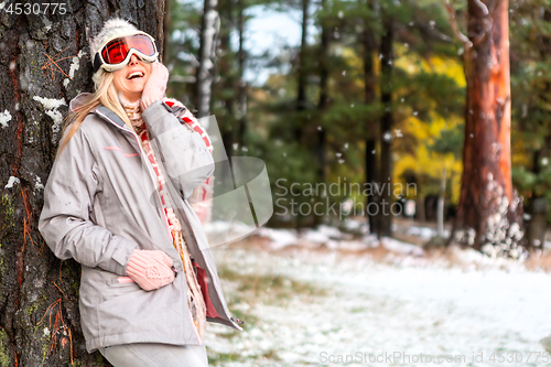 Image of Joyful female in a snowy winter woodland forest