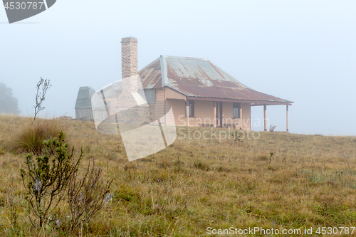 Image of Old homestead in thick morning fog