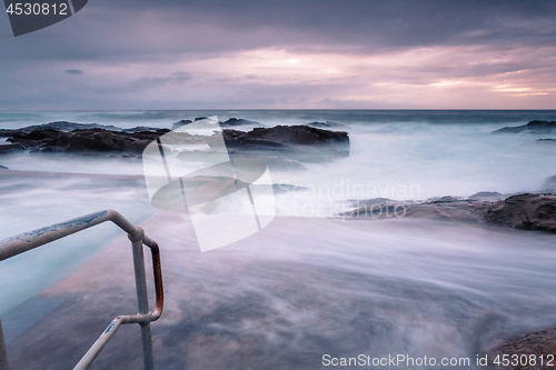 Image of Large waves engulf the public rock pool in Bermagui