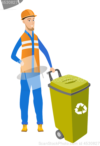 Image of Young caucasian builder pushing recycle bin.
