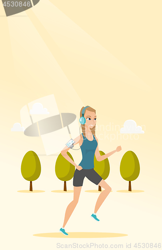 Image of Young man running with earphones and smartphone.