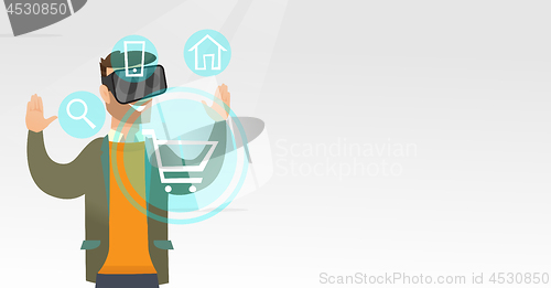 Image of Man in virtual reality headset shopping online.