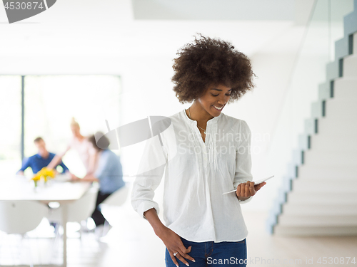 Image of Portrait of  black casual businesswoman using tablet  with cowor