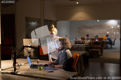 Image of young designers in the night office