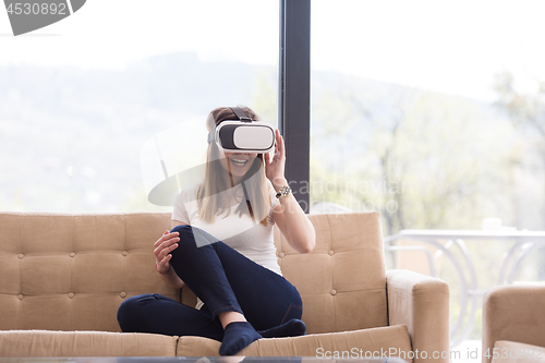 Image of woman using VR-headset glasses of virtual reality