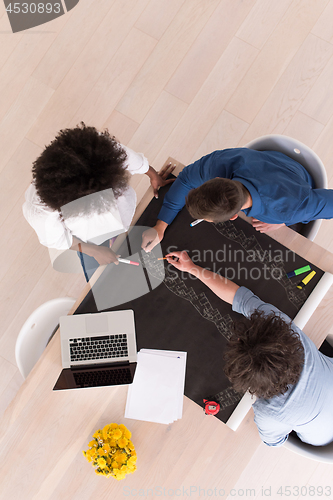 Image of top view of Multiethnic startup business team on meeting