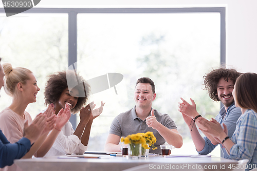 Image of multiethnic startup Group of young business people celebrating s