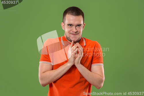 Image of Young serious thoughtful businessman. Doubt concept.