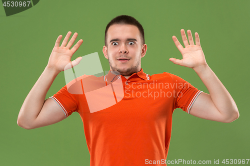 Image of The young attractive man looking suprised
