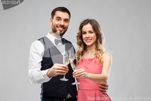 Image of happy couple with champagne glasses toasting