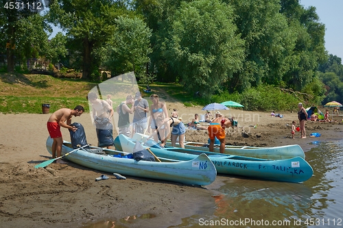 Image of Canoes on the Riverside