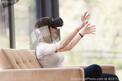 Image of woman using VR-headset glasses of virtual reality