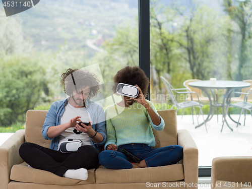 Image of Multiethnic Couple using virtual reality headset