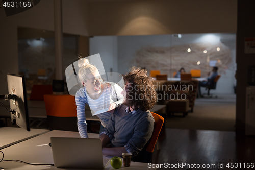 Image of young designers in the night office