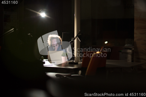 Image of businessman relaxing at the desk