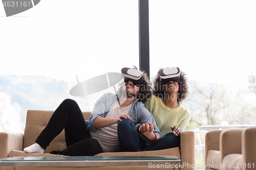 Image of Multiethnic Couple using virtual reality headset