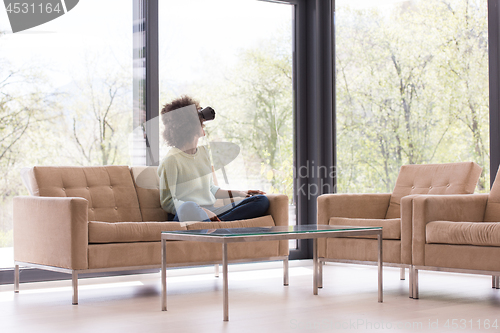 Image of black woman using VR headset glasses of virtual reality