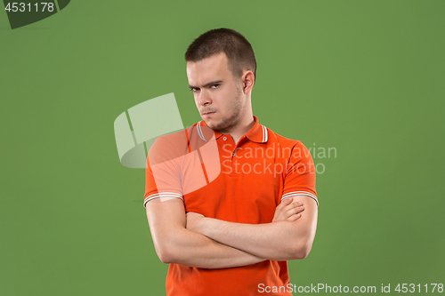 Image of Suspiciont. Doubtful pensive man with thoughtful expression making choice