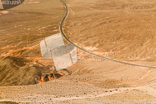 Image of aerial view of road in grand canyon desert