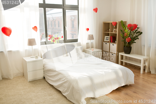 Image of cozy bedroom decorated for valentines day