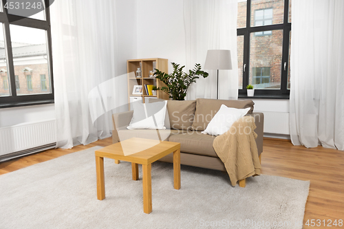 Image of interior of home living room with sofa and table