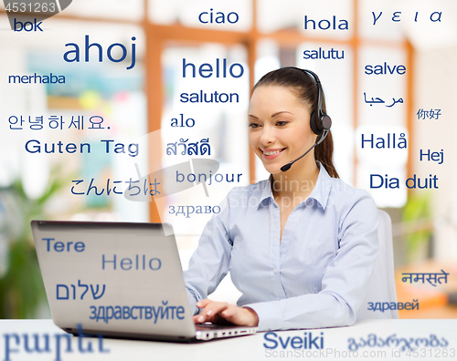 Image of woman with laptop over words in foreign languages