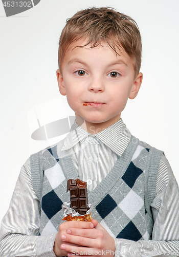 Image of Little boy eating chocolate