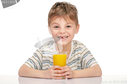 Image of Little boy with orange juice