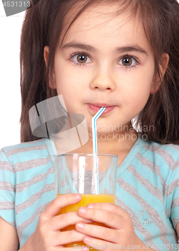 Image of Little girl drinking orange juice