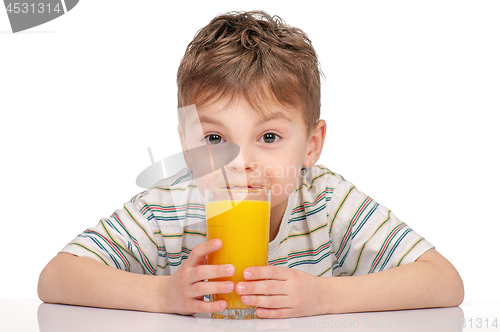 Image of Little boy with orange juice