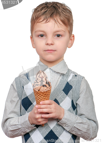 Image of Little boy eating chocolate ice cream